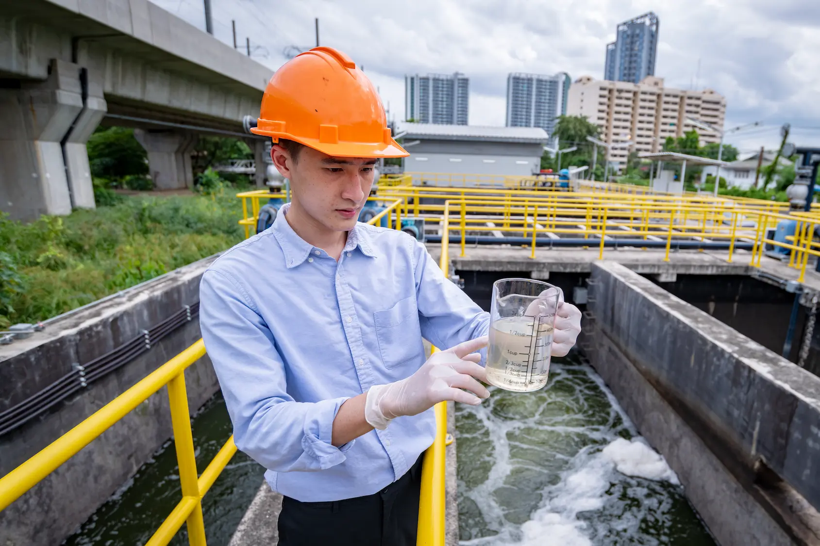 engineer take water from wastewater treatment pond 2025 03 13 19 23 47 utc