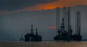 a oil drilling platform during sundown
